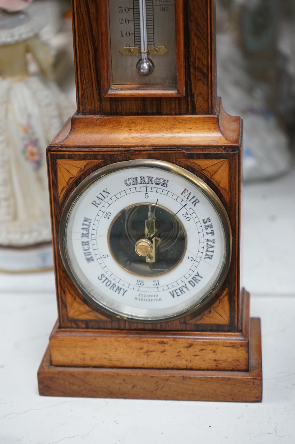 A miniature inlaid rosewood longcase clock with French movement and integral aneroid barometer and thermometer, the dial inscribed Aldis, Pimlico, 47cm high